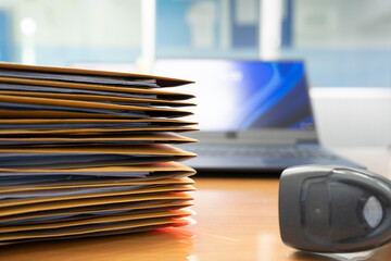 Stacks of Brown envelope, piles of unfinished documents, Business report papers, Using scanner machine for convert document to digital data storing into computer.