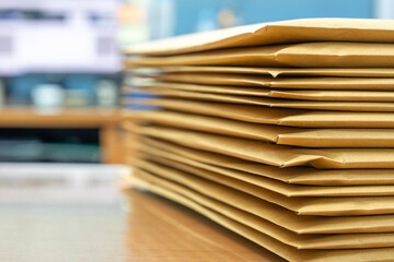 Stacks of Brown envelope, piles of unfinished documents, Business report papers, Using scanner...