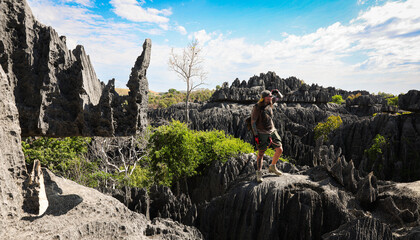 Bekopaka, Madagascar - May 27, 2024: Exploring the unique limestone formations of Tsingy de Bemaraha National Park, Madagascar, as a tourist admires the natural beauty
