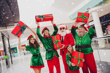 Portrait of attractive cheerful trendy group elfs holding giftboxes buying having fun rejoicing...