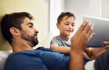 Relax, tablet and movie with father and son for live streaming, subscription service and technology. Social media, happiness and app with man and child in family home for internet, digital or website