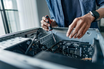 Computer repair technician specialist repairing and testing on Pc