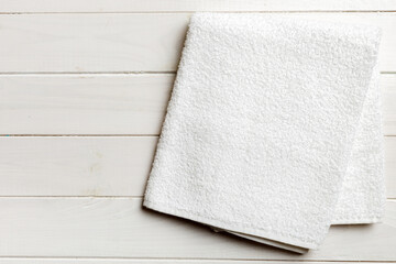 Top view of white towels with copy space on colored background