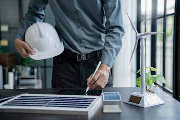 Business eco Alternative, sustainable electricity, people creating ideas working on green energy