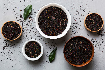 quinoa seeds in bowl on colored background. Healthy kinwa in small bowl. Healthy superfood