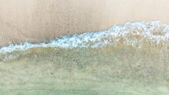 Top view beach sand background for summer vacation concept. Beach nature and summer seawater with sunlight light sandy beach Sparkling sea water	
