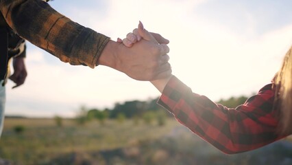 Group tourists helps lend a helping hand. Teamwork business travel concept. The man extends his...