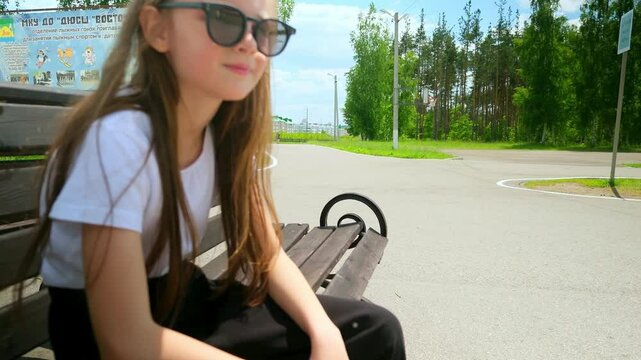 Roller blades. Roller skating girl kid in park rollerblading on inline skates.