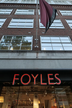 Exterior of the famous Foyles bookshop in the centre of London, with its iconic red sign, and flag flying above. London, UK 08 27 2024 