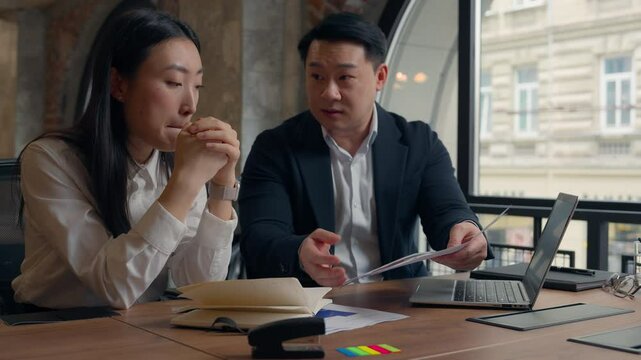 Angry boss Korean Asian businessman man guy business male leader boss teacher scold blame talk to student girl paper wrong data documents bad result failure Chinese Japanese woman businesswoman female