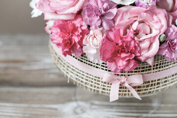 Florist at work. How to make floral decorations on summer party table. Centerpiece with rose and carnation flowers. Romantic wedding reception. Step by step, diy.