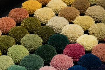 Close up isometric shot of multiple colorful carpet textile samples. Color palette variations. 
Textile industry concept.