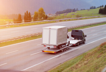 Emergency Tow-Truck With Disabled Commercial Cargo Bus
