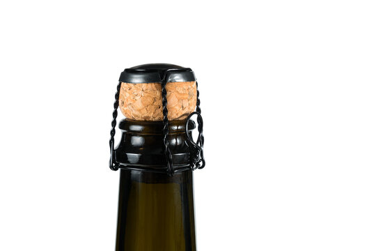 Close-up of the cork and muselet closure atop a bottle of sparkling wine unopened