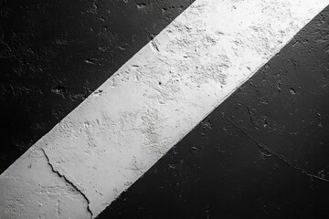 Fototapeta premium A Diagonal White Stripe on a Rough Black Surface