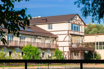 ranch Wild West style hotel apartment building real estate architecture exterior urban landmark view in spring time vivid colors and clear weather