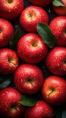 Fresh red apples arranged artistically on a seamless background, showcasing droplets and vibrant colors in professional photography