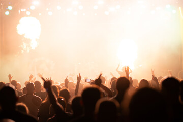 Fototapeta premium Crowd at concert and colorful stage lights.
