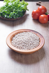 White beans on wooden table in kitchen