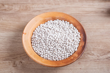 White beans on wooden table in kitchen
