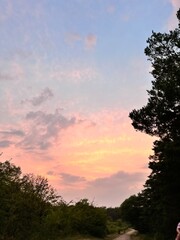 Beautiful clouds at sunset with  silhouette trees