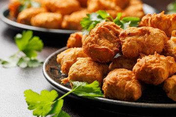 Homemade crispy fried chicken nuggets served with ketchup