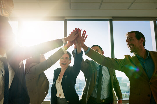 Happy, business people and high five with team for collaboration, motivation or success at office. Group, employees and hands together with unity for solidarity, community or mission at workplace