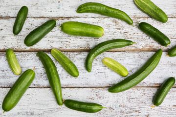 Freshly harvested cucumbers on rustic wooden surface â€“ Homegrown produce gardening