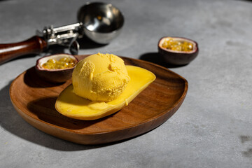 Mango and passion fruit ice cream ball