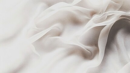 Fototapeta premium A close-up of soft, flowing white fabric with gentle folds and textures.