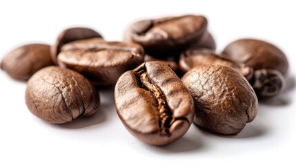 Naklejka premium Close up of roasted coffee beans on white background with selective focus