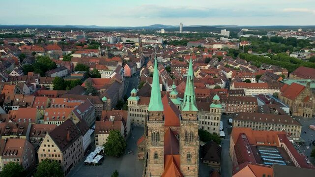 4K Aerial Drone Video of Medieval Sebalduskirche Church with twin spiers in Nurnberg, Germany - Truck left