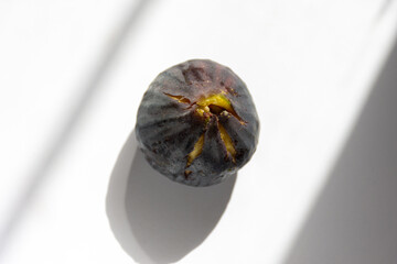 High-angle view of a fig on a table.