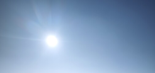 Shiny sun and clear blue sky noon excessive heat background