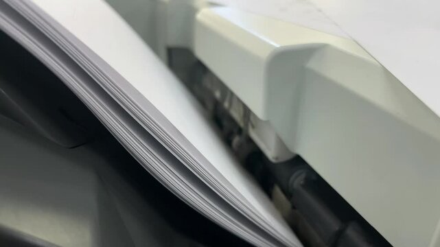 Papers coming out of copy machine 4K close-up video footage