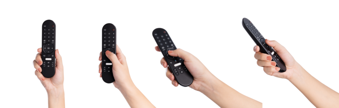 Hand holding television remote isolated on white background.