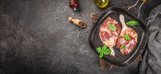 raw duck legs in grill pan. banner, menu, recipe copy space, top view