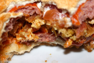 bitten hot dog. brazilian hot dog. pressed hot dog with selective focus.