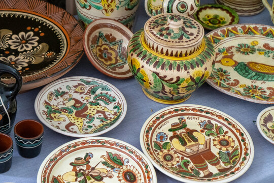 Empty crockery. Ukrainian ceramics. Painting of plates. Clay dish. Pottery bowl.