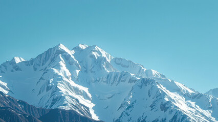 Obraz premium Snow-capped mountains against a clear blue sky