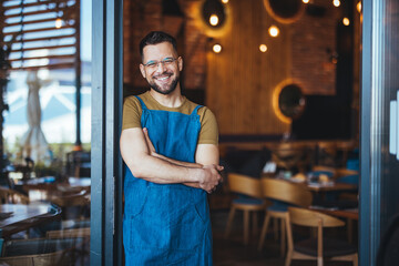 Smiling Cafe Owner Standing Proudly in Doorway