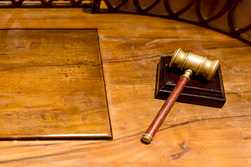 Old judge gavel. Wooden gavel on desk