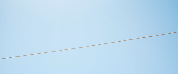 Single Power Line Against Blue Sky