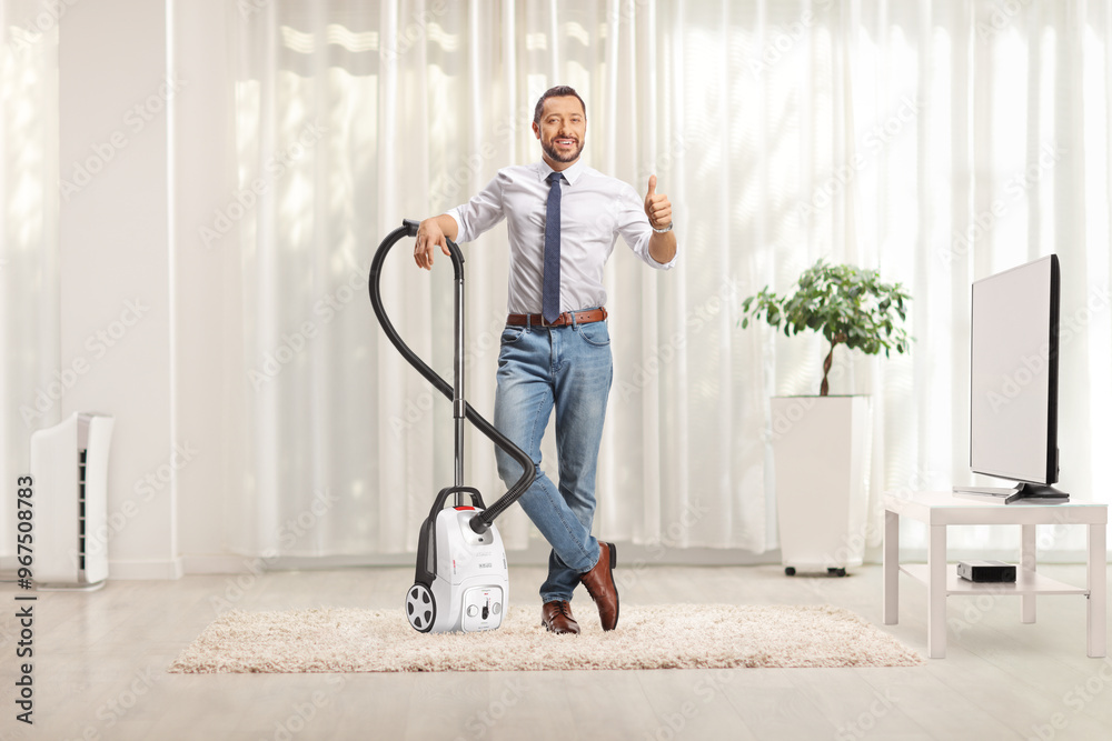 Sticker Man gesturing thumbs up and standing with a vacuum cleaner