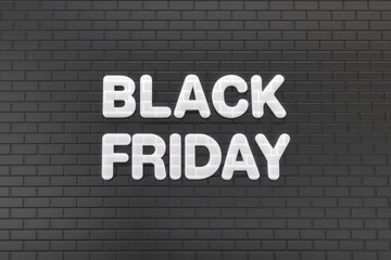 Obraz premium Black brick wall with the word black friday, sale and promotion concept.