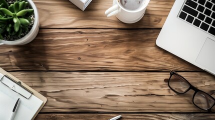 Modern Office Desk with Laptop, Coffee, Glasses, and Notepad on Wooden Surface