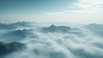 Obraz premium A breathtaking aerial view of a dense sea of morning mist flowing through a mountain