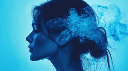 A serene profile of a woman surrounded by ethereal blue smoke, capturing a moment of introspection and tranquility.