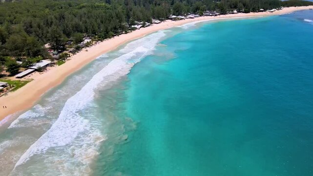 Captivating Aerial View of Ripples Rolling Over the Beach