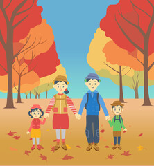 秋のハイキングを楽しむ家族